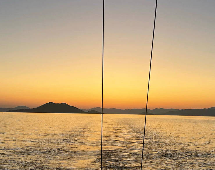 View of the sunset from a sailing boat